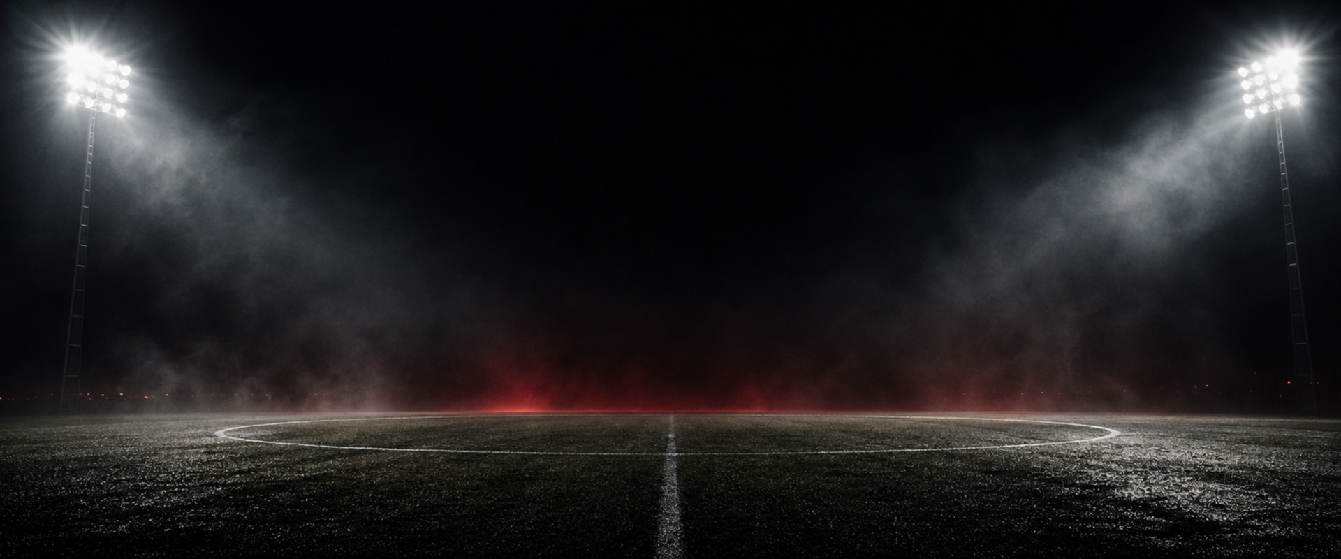 Floodlit pitch under stadium lights