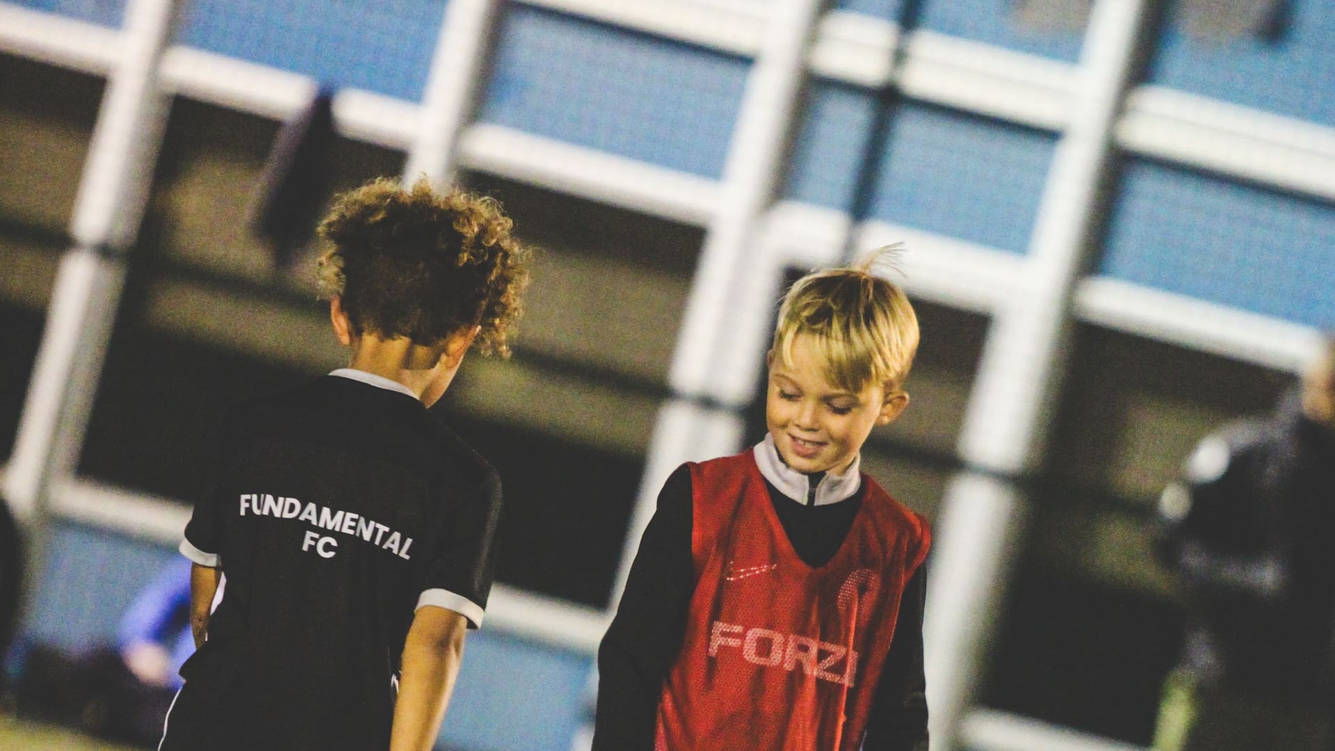 Fundamental FC players in a floodlit development session