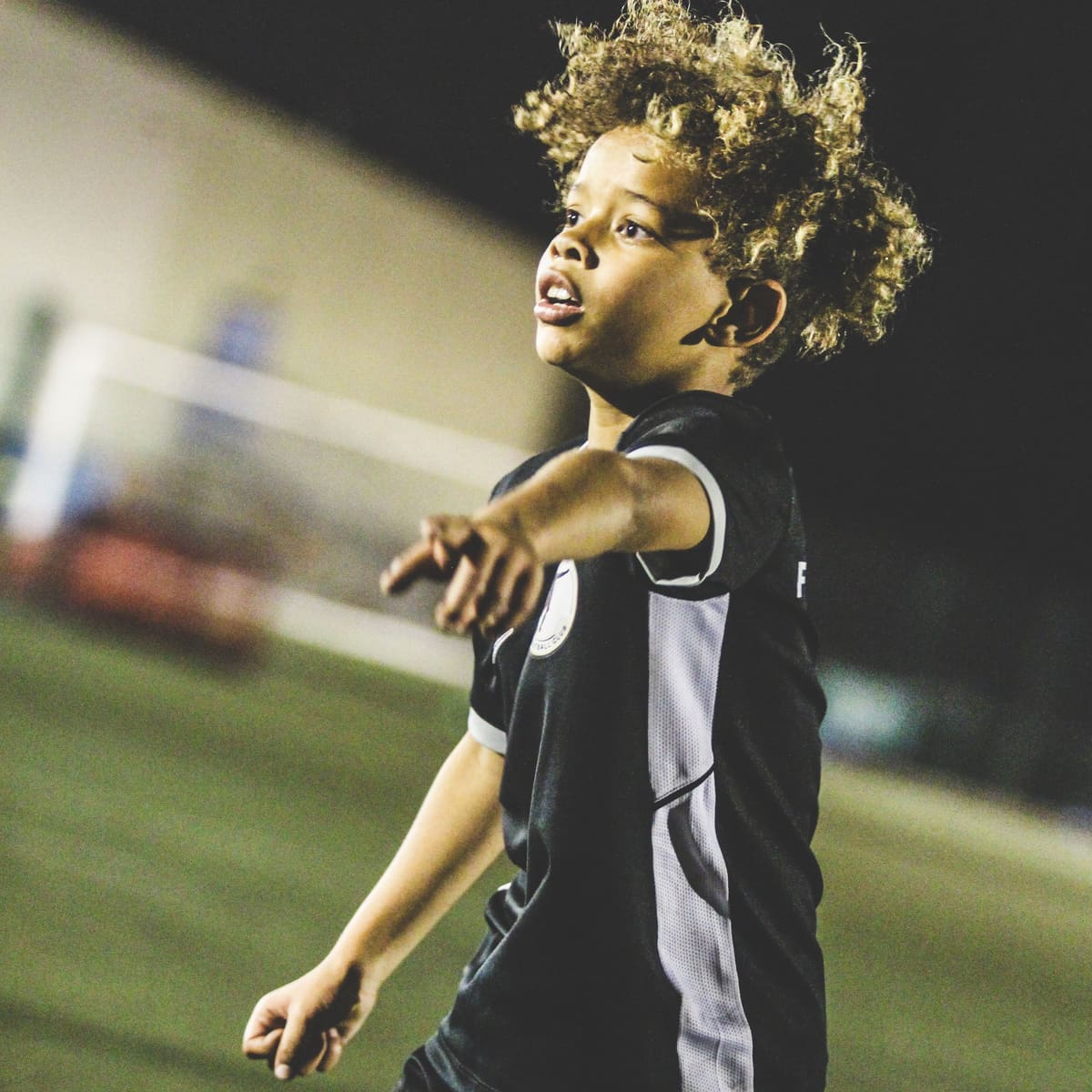 A young player moving into space during a drill