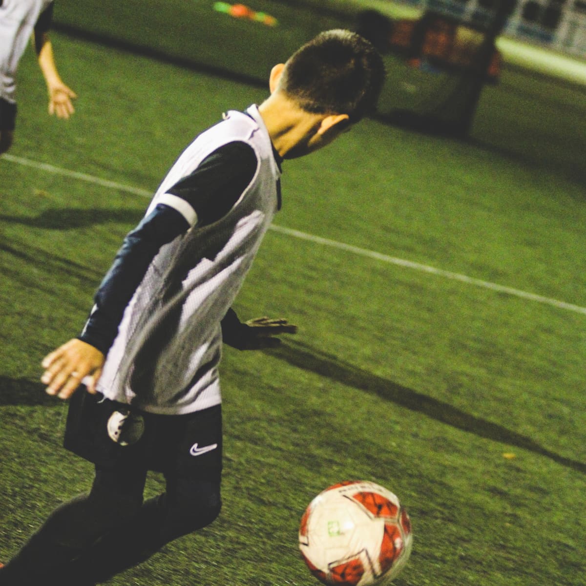 A player controlling the ball in training