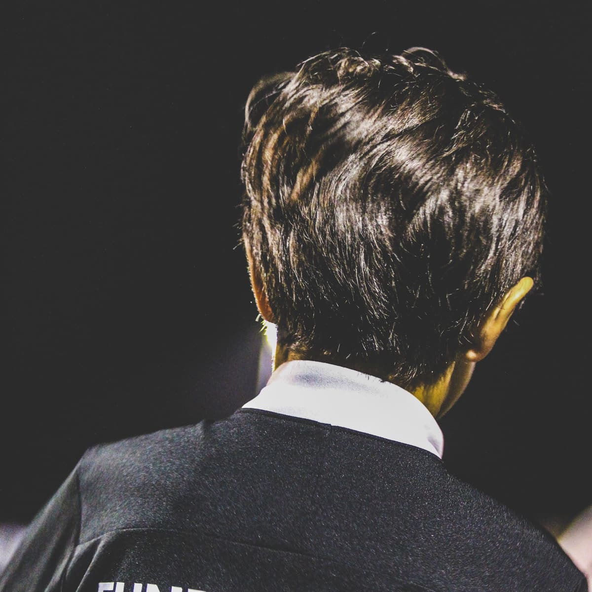 A player in Fundamental FC kit watching the session